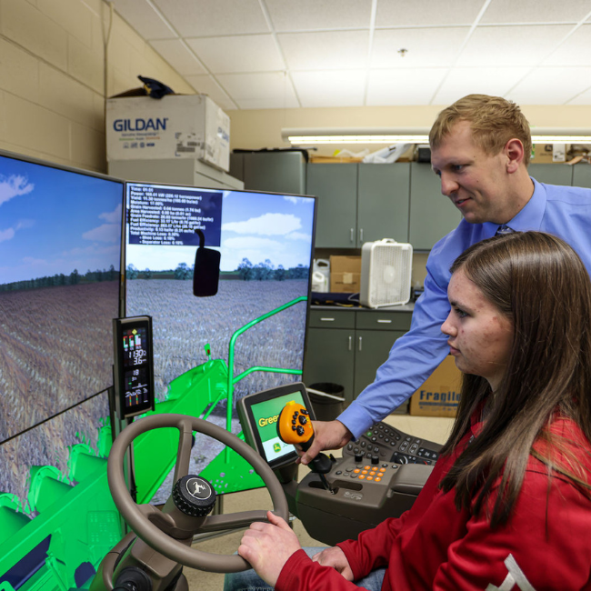 Instructor and Student at Ag Simulator