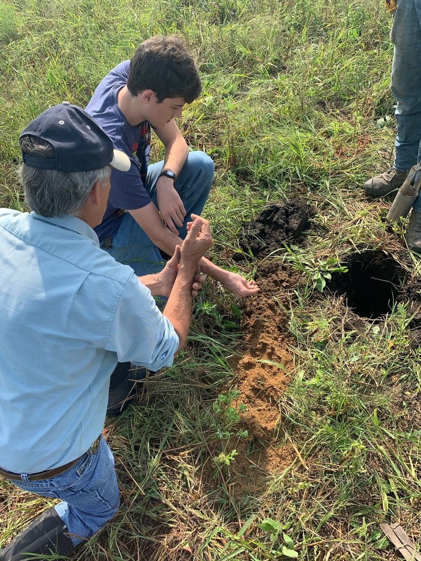 Students learning soil science
