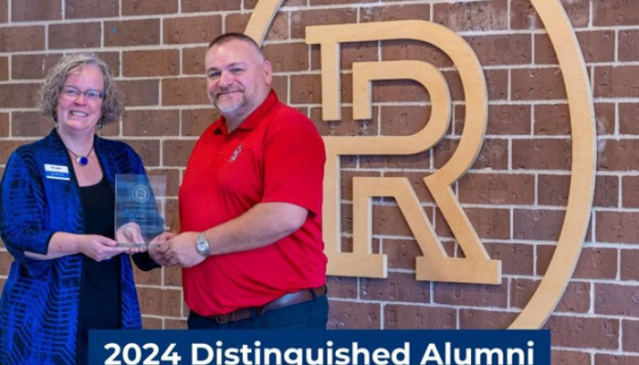 Jason Forwald with President Kat Linaker presenting award