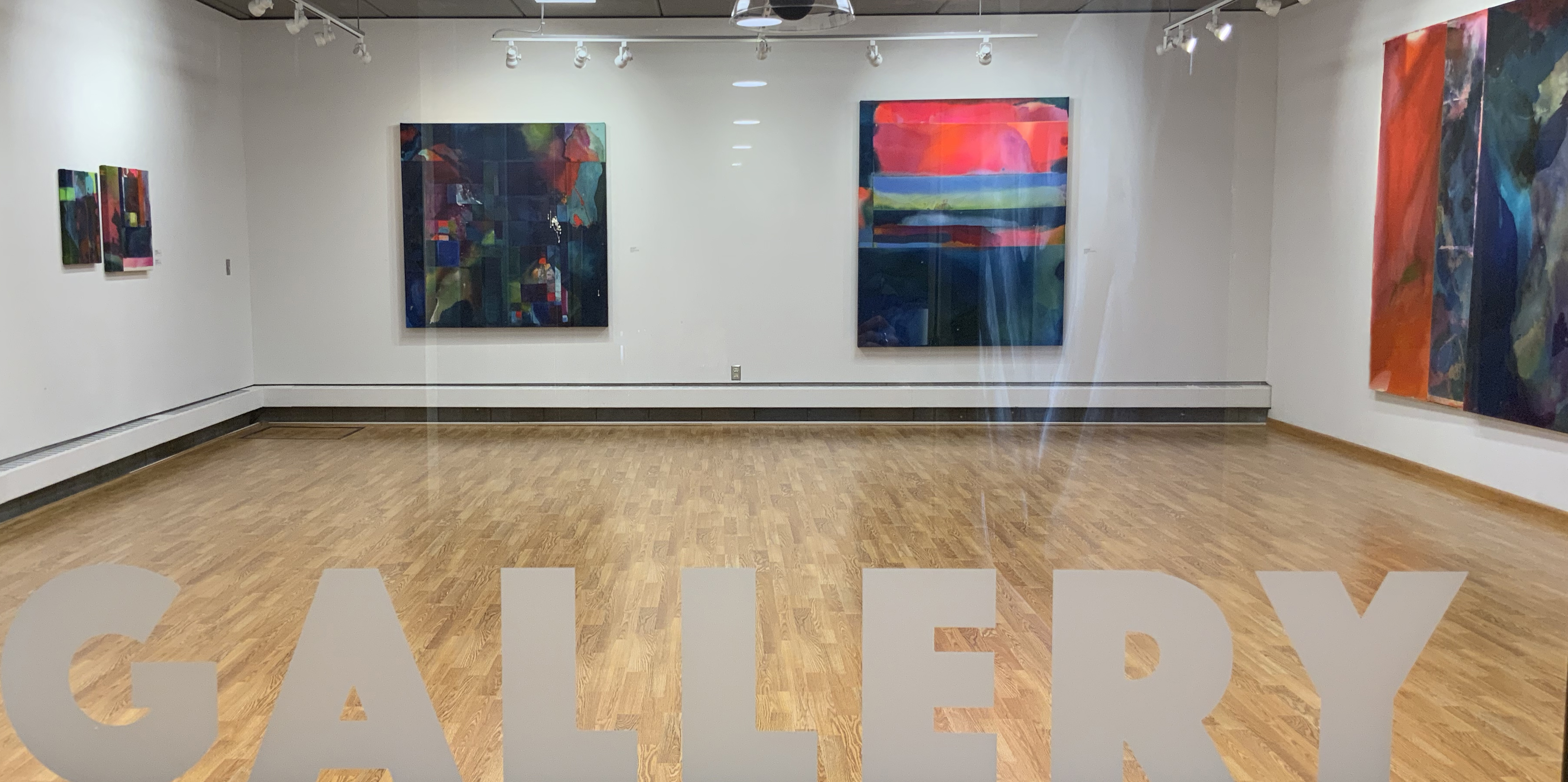 James Wegner Gallery interior with artwork displayed on white walls and track lighting