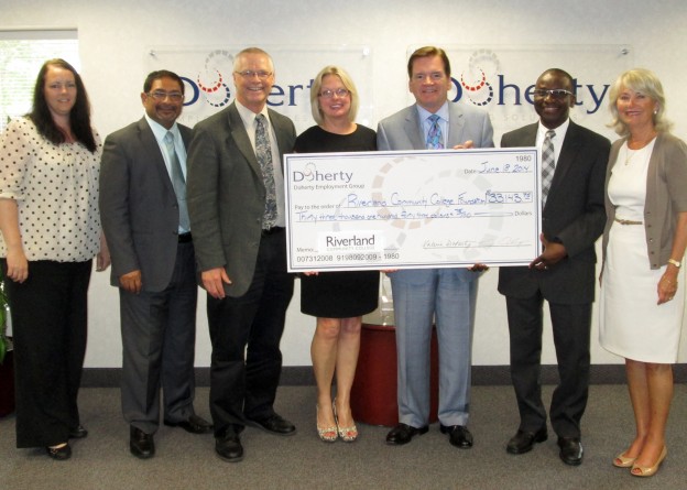 Doherty Staffing Solutions presented a check for $33,143 raised at the 2013 Doherty Scholarship Golf Classic to Riverland President Adenuga Atewologun and Steve Bowron, dean of institutional advancement. Pictured (l to r): Talitha Shaner, Gauher “Mo” Mohammad, Bowron, Val Doherty, Tim Doherty, Atewologun and Pat Robertson.