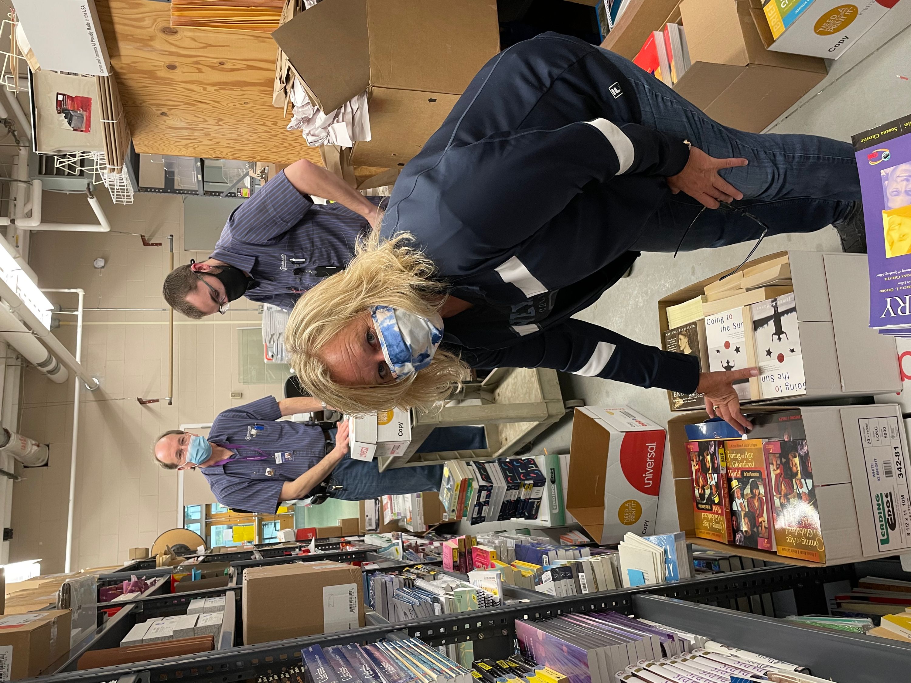 Bookstore Staff and Maintence Workers loading boxes